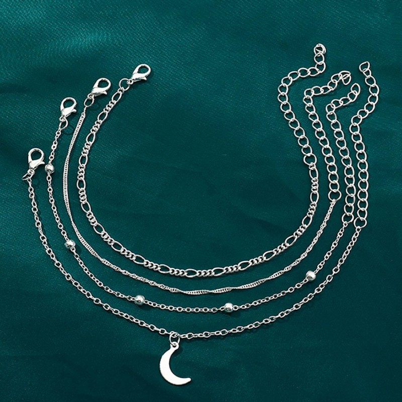 Tobillera con cuatro cadenas plateadas